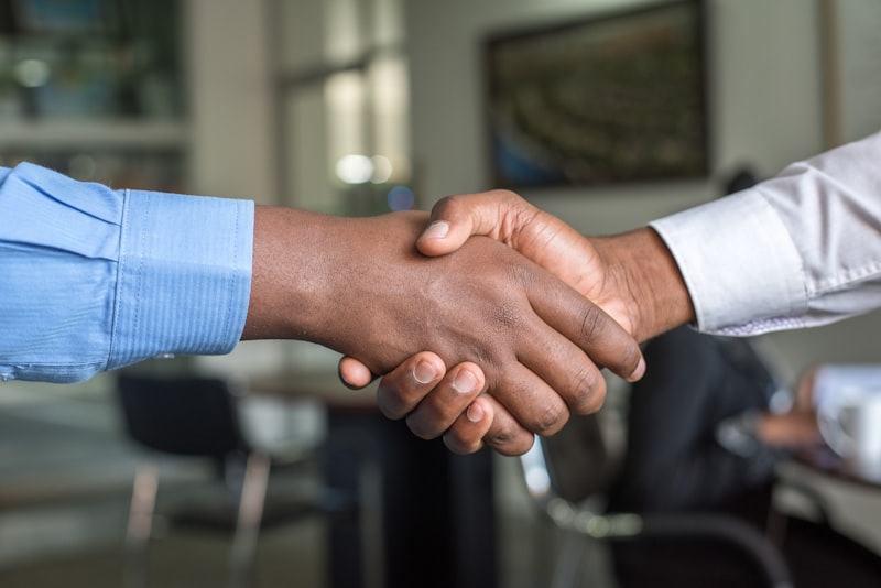 Handshake after negotiating a fair workers compensation settlement